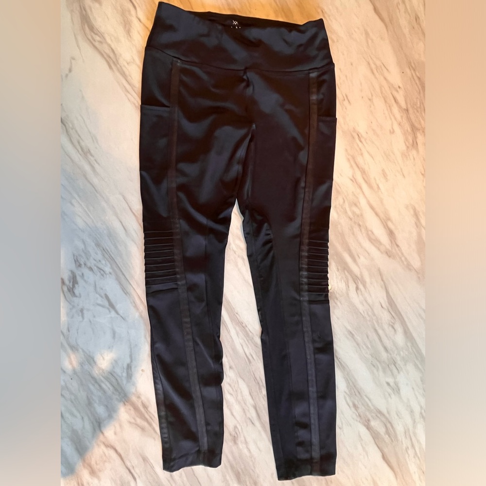 Vina Leggings size Medium Black with mesh and motto accents. Pockets.